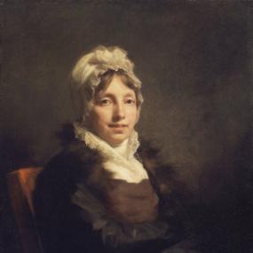 Portrait of Mrs. Alexander, shown from the waist up. She appears to be wearing a fur coat and a white bonnet.