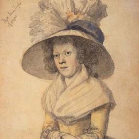 Black and white photograph of a drawing of Ann Martin Taylor, seated in a chair that is upholstered with flowers, wearing a simple, long, dark dress with a high collar and wide sleeves. She is wearing a white bonnet that is tied in a bow at her chin and a pair of small wire spectacles. Signed underneath the drawing are the words: affectionately yours, Ann Gilbert.